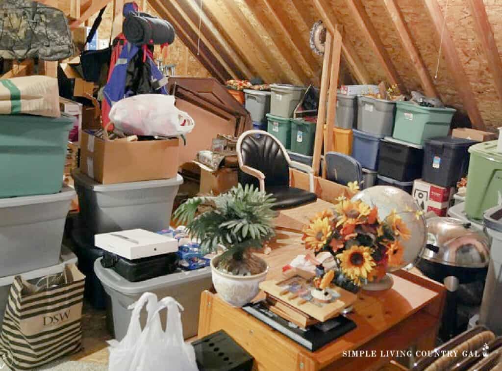 an attic filled with piles, totes, boxes, and random clutter