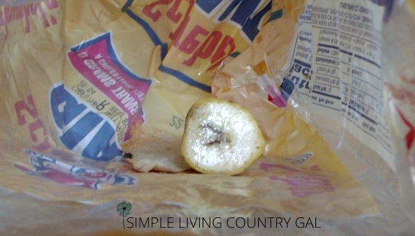 A view of a piece of banana sitting inside of a bread bag