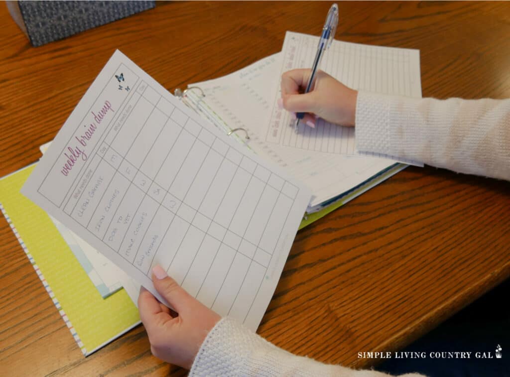 a woman making a to do list 