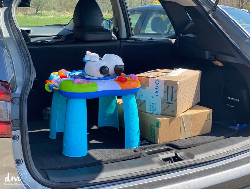 boxes and toys in a trunk ready for donation