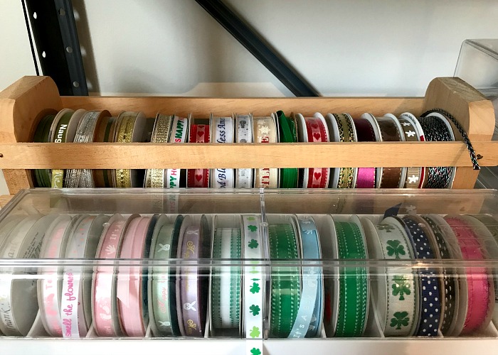Organize your craft room on the cheap using wooden or plastic ribbon holders. 