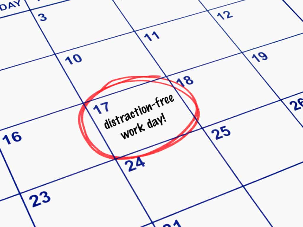 a calendar with a red circle on the 17th day with the words, distraction free work day! written inside