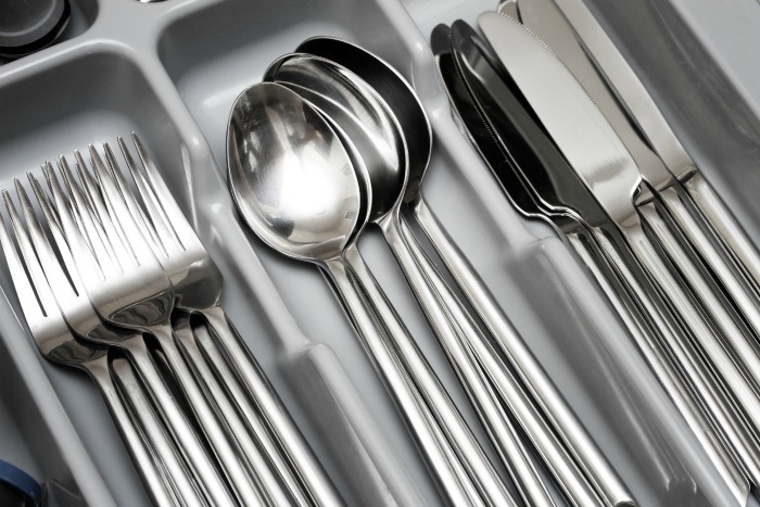 Utensils organized in a clean tray after a 3 minute declutter task
