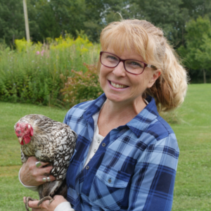 A gal named Tracy Lynn holding a chicken