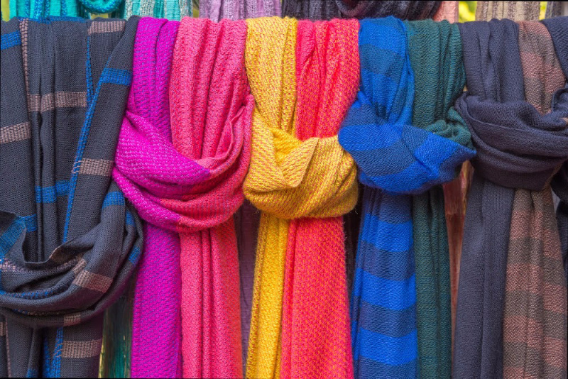 Scarves are hung neatly on a rail so you can find what you are looking for quickly without drowning in clutter.