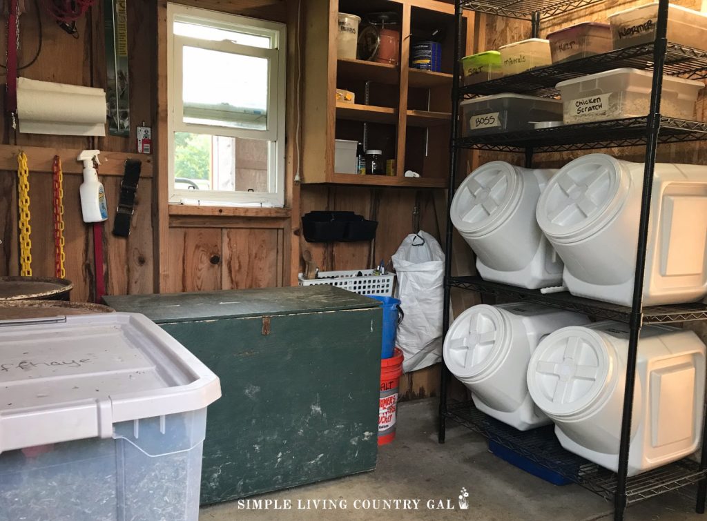 feed room on a homestead that has different livestock feed storage containers housed inside