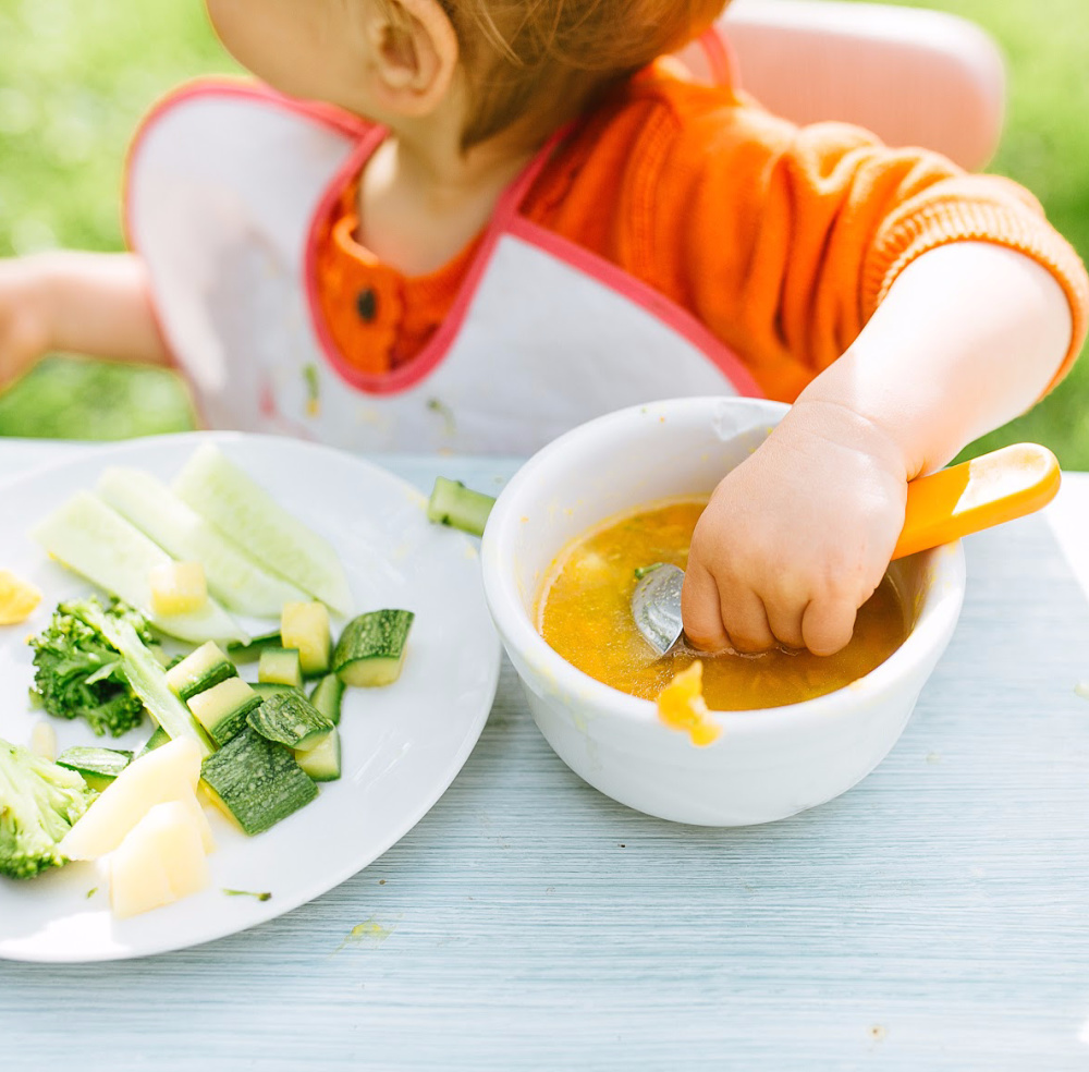 baby eating homemade baby food