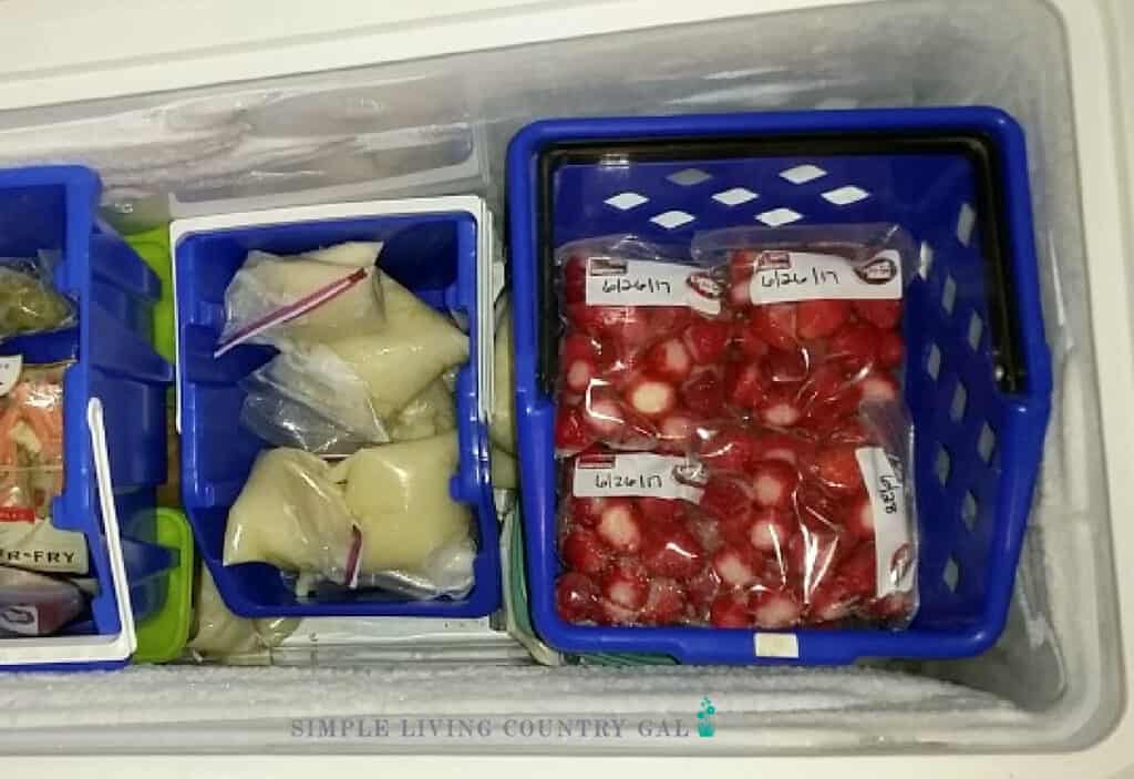 Strawberries in freezer bags in a freezer