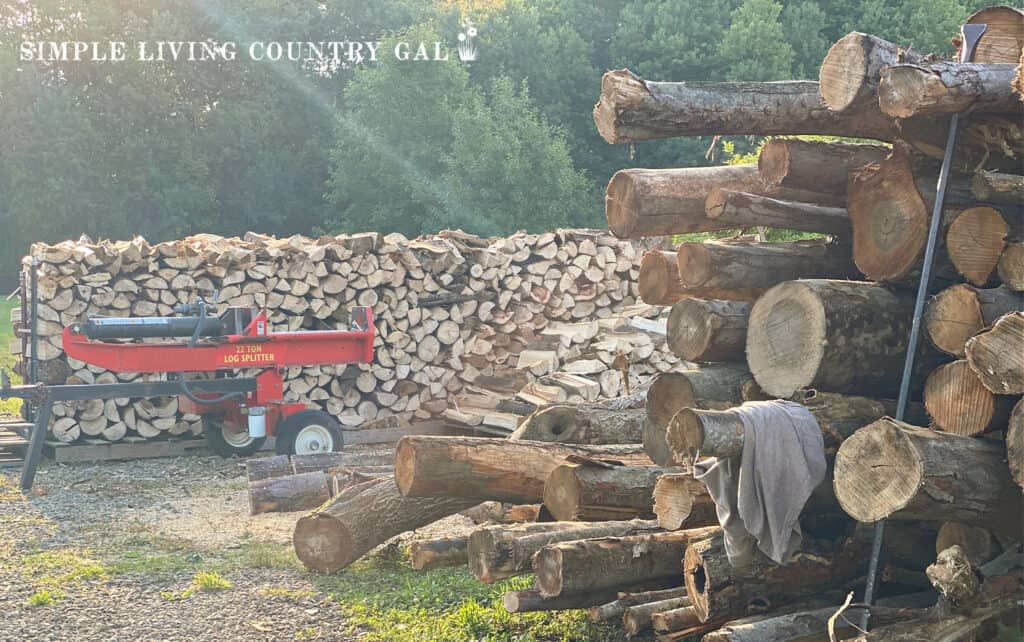 pile of split wood near a wood splitter