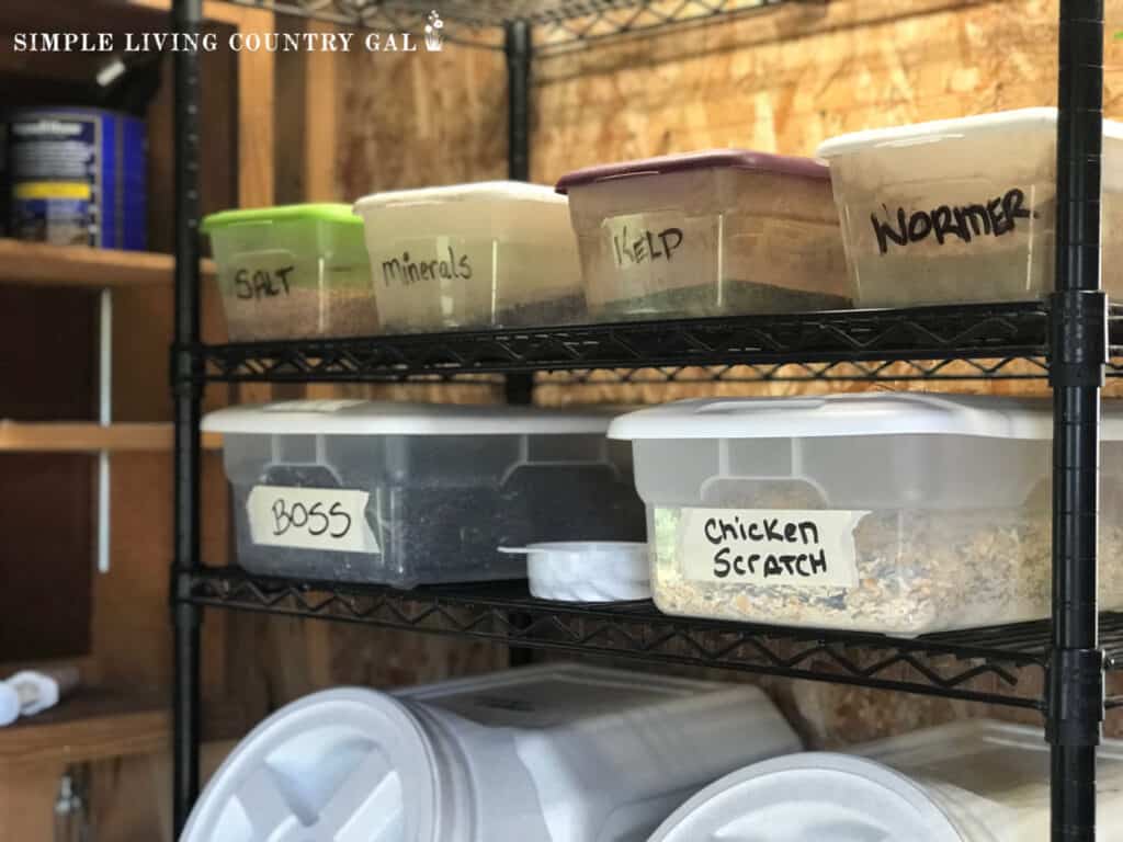 labeled bins in a feed room of a barn