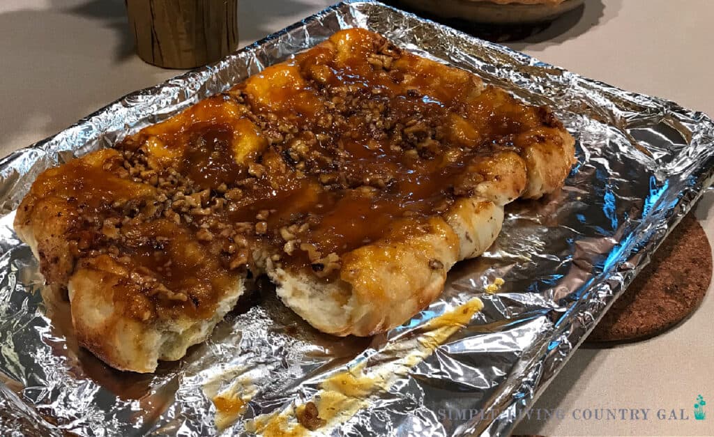 homemade sticky buns on a foil lined sheet