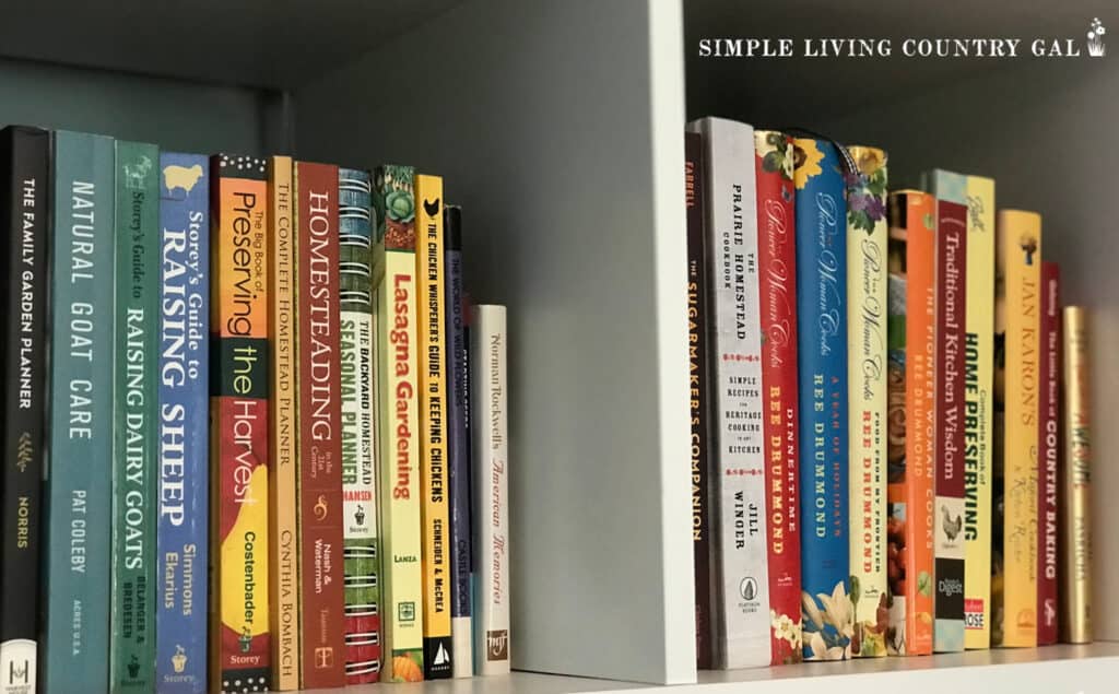 a collection of homesteading books on a white bookshelf