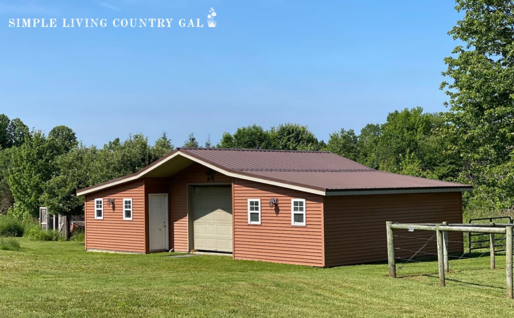 red goat barn on a summer day