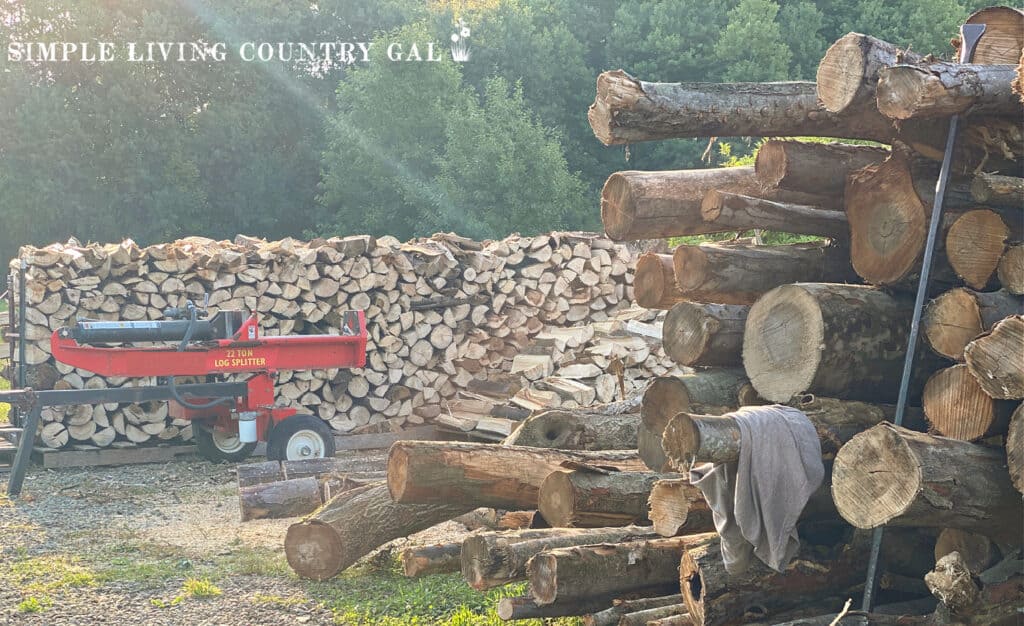 pile of split wood near a wood splitter 