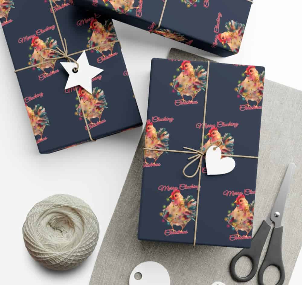 wrapping paper covered in chickens with scissors and tape near by