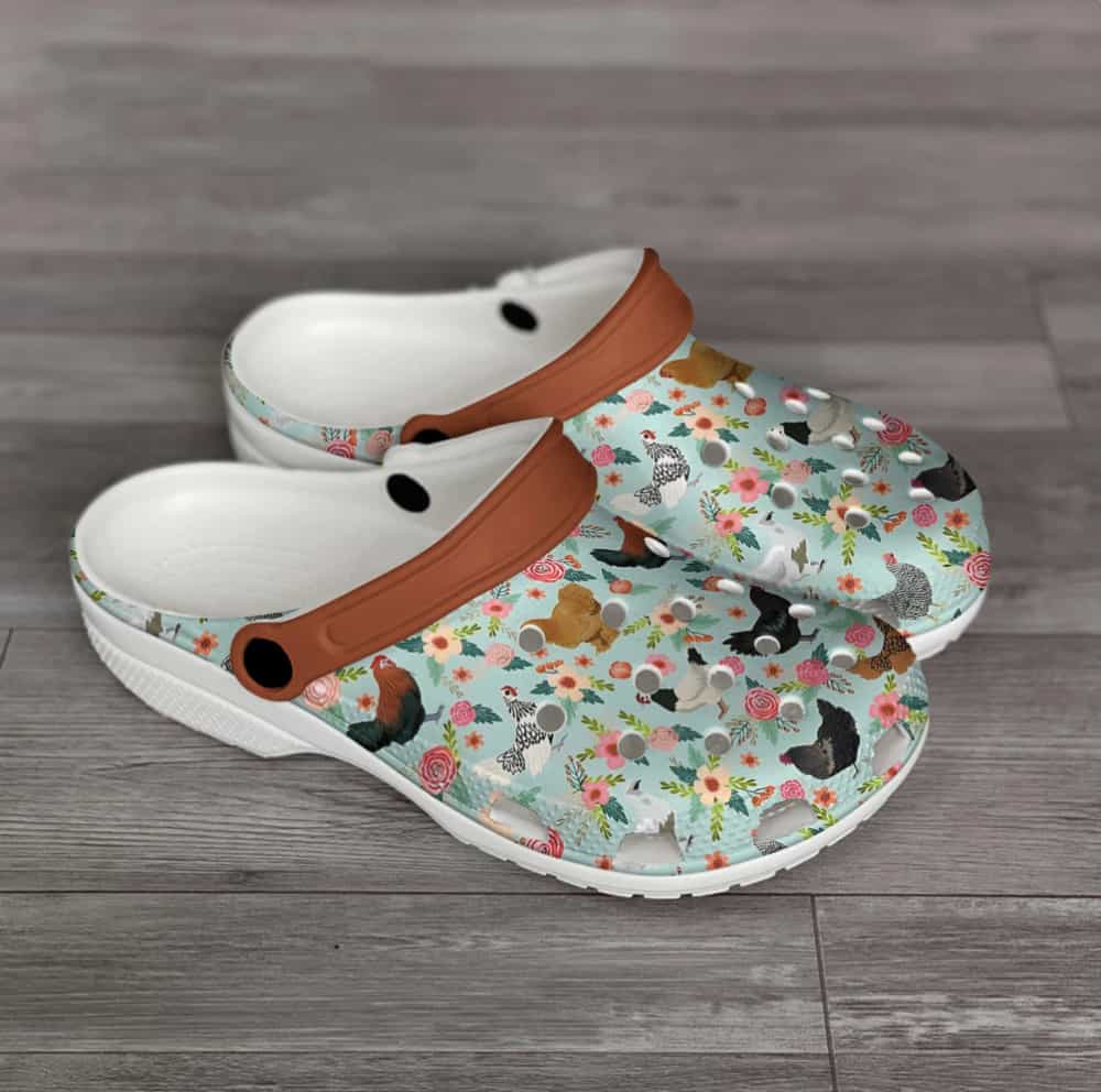 white crock shoes with chickens and flowers on the top