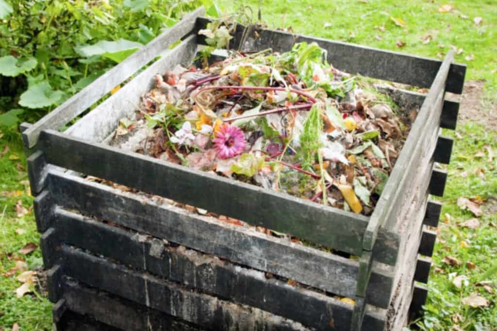 Compost bin in the garden made from pallets