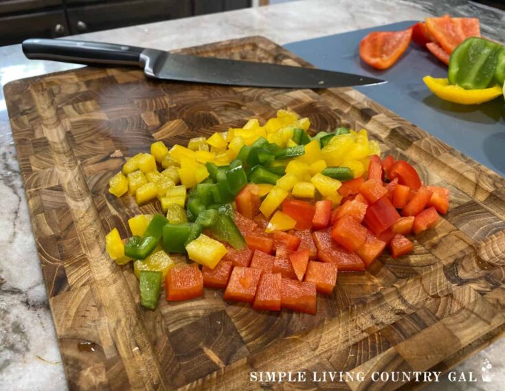 diced peppers on a cutting board in a kitchen