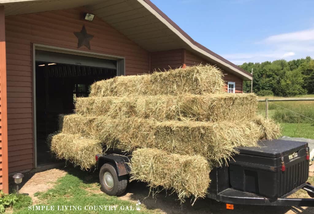 a trailer full of bales of hay