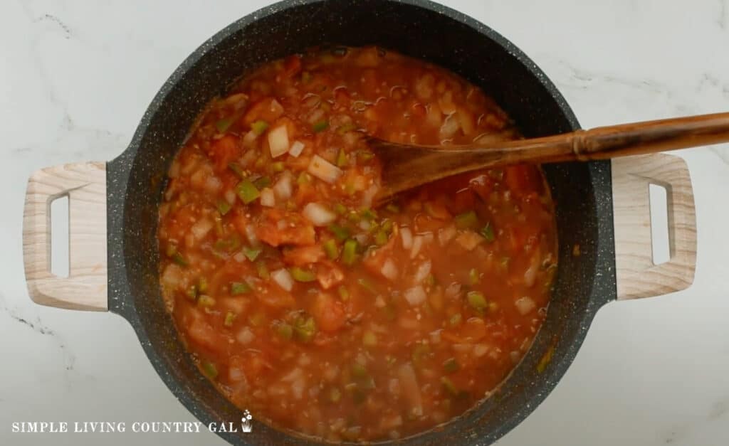 an overhead shop of salsa in a pan for canning