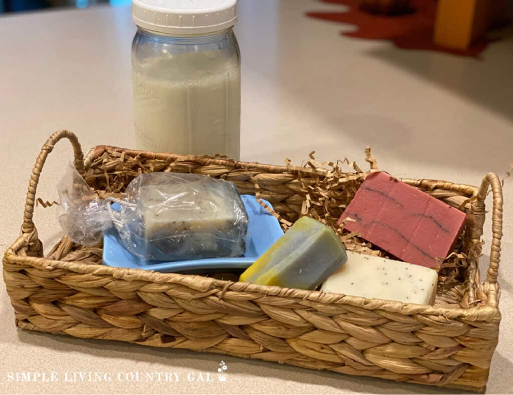 basket of goat milk soap with milk in the background
