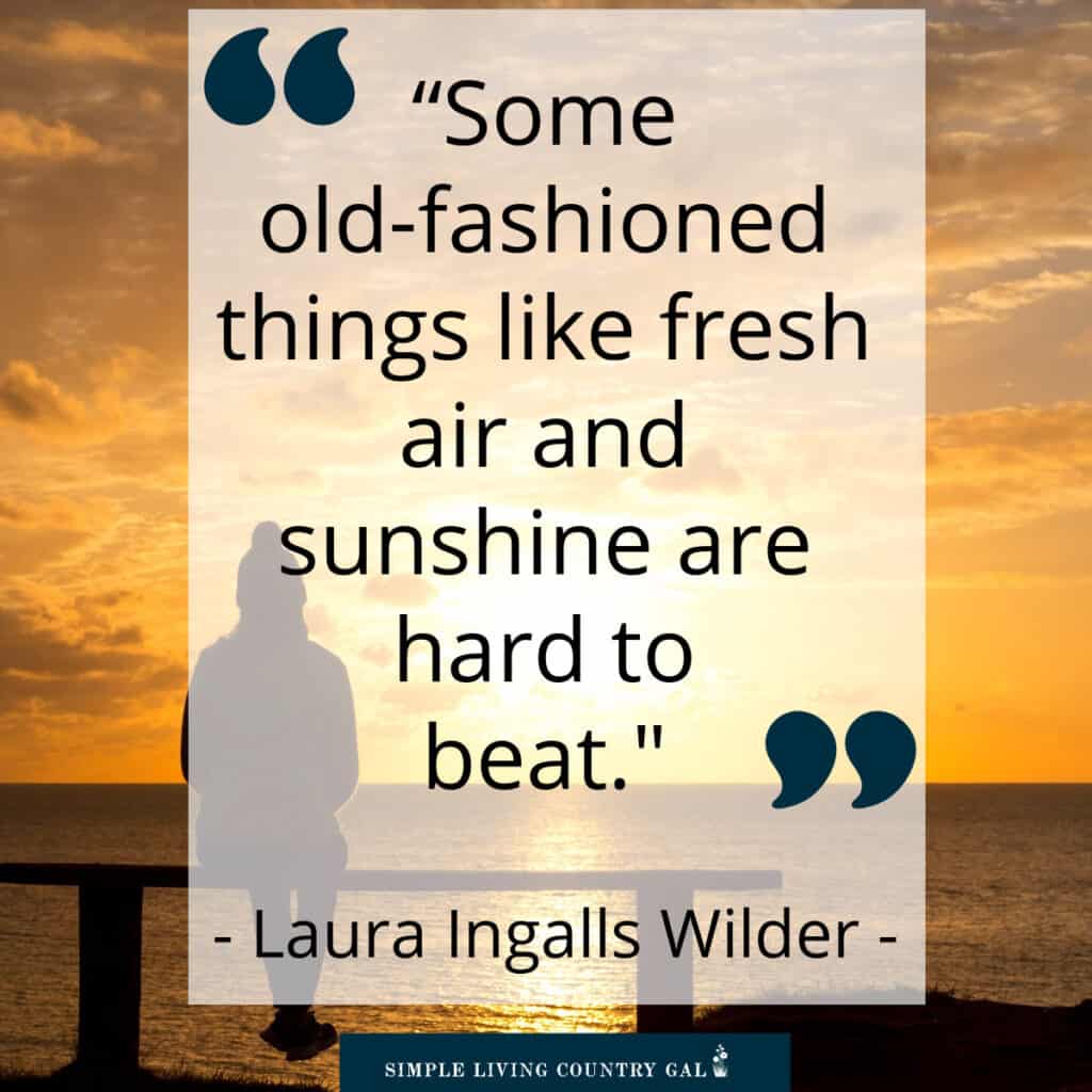 a quote by laura ingalls wilder on simple living over a sunset image