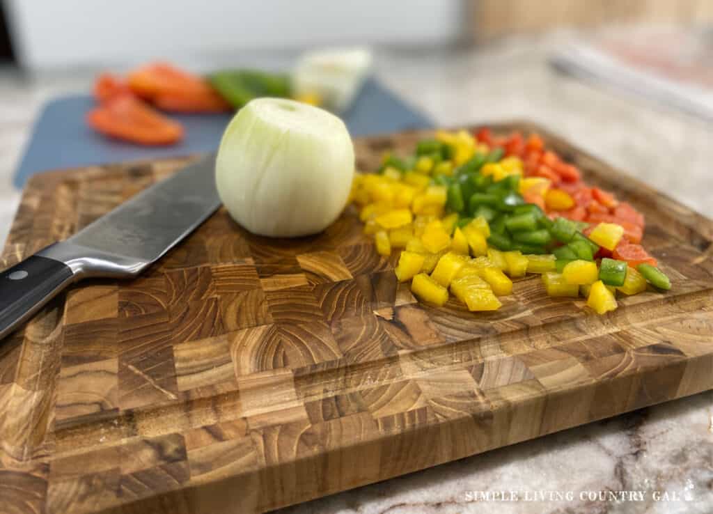 a cutting board with chopped veggies on top