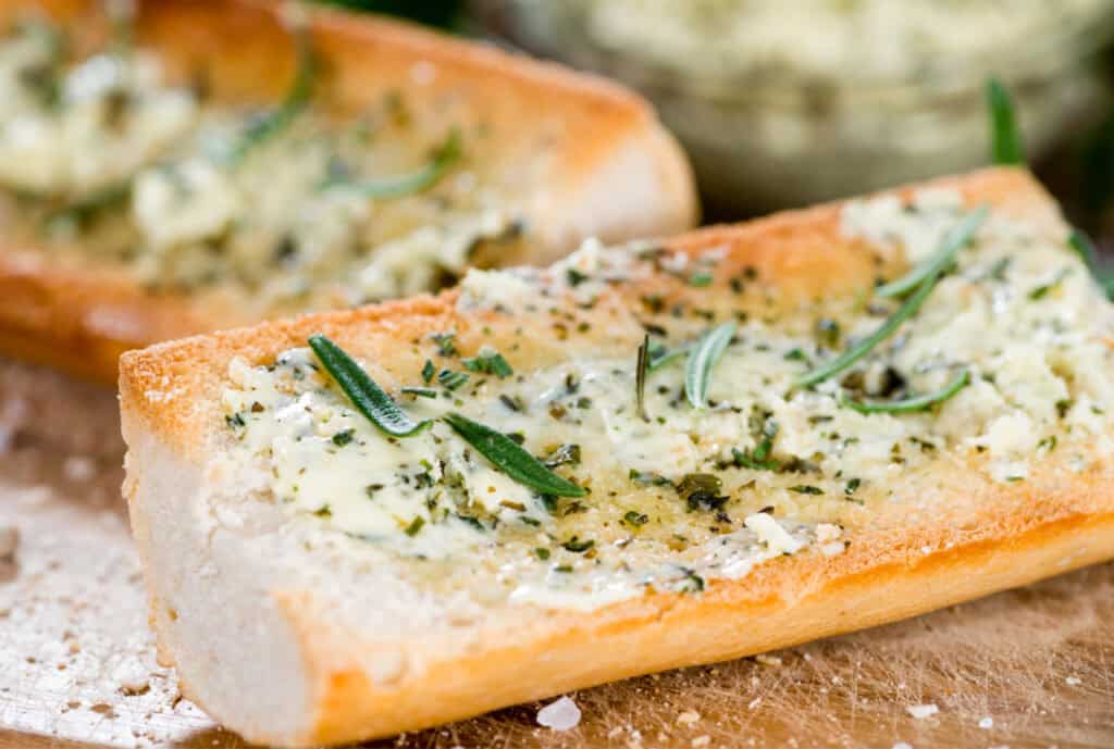 rolls with homemade herb butter spread on top