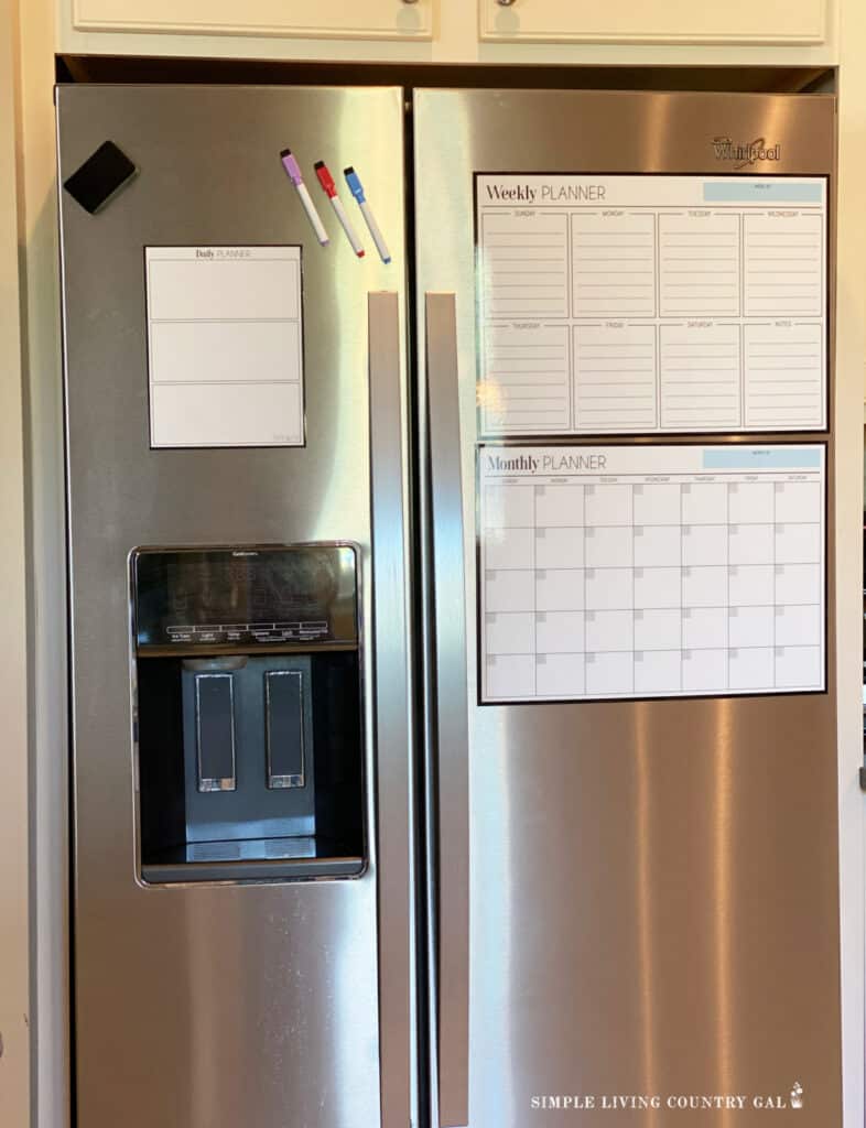 a fridge with magnetic lists on the front, highlighters and an eraser