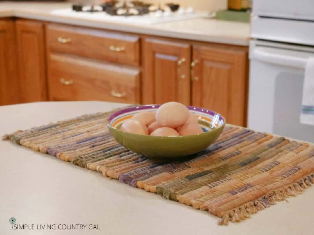 eggs in a bowl on a kitchen counter 