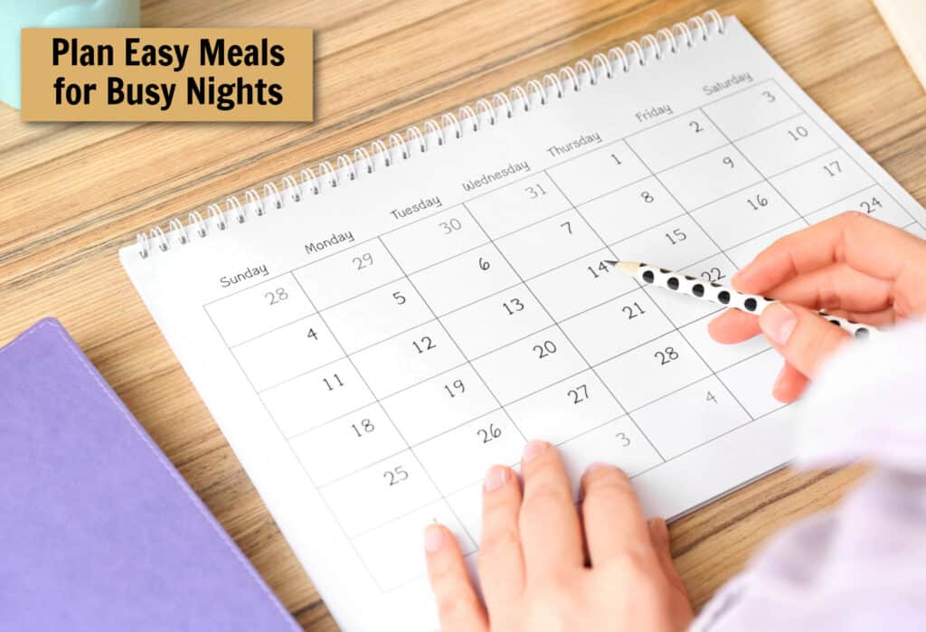 hands pointing to a date on a calendar